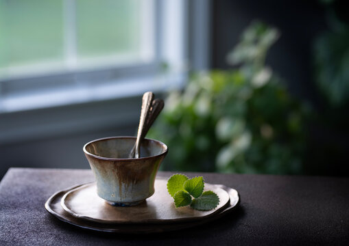 Cup with two spoons