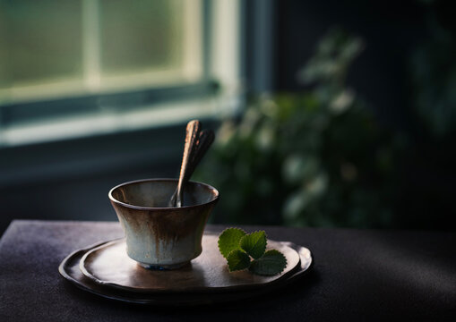 Cup with two spoons