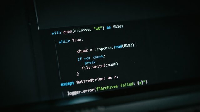 Python programming code displayed on a computer screen showing a file download script with error handling and logging functions in dark mode