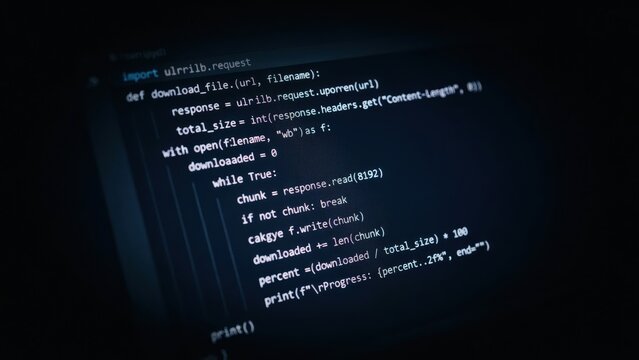 Python programming code displayed on a dark computer screen showing a file download function with syntax highlighting and indentation structure
