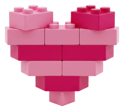 A stylized heart meticulously constructed from bright pink and deep magenta wooden toy building blocks, isolated on a transparent background with copy space, concept of building love and creativity