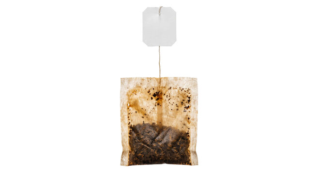 Single used tea bag with a blank label and string, isolated on white