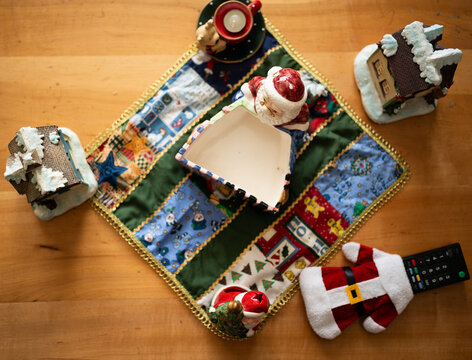 Top View Christmas Table Decoration with Santa Ornaments and Snow Cottages