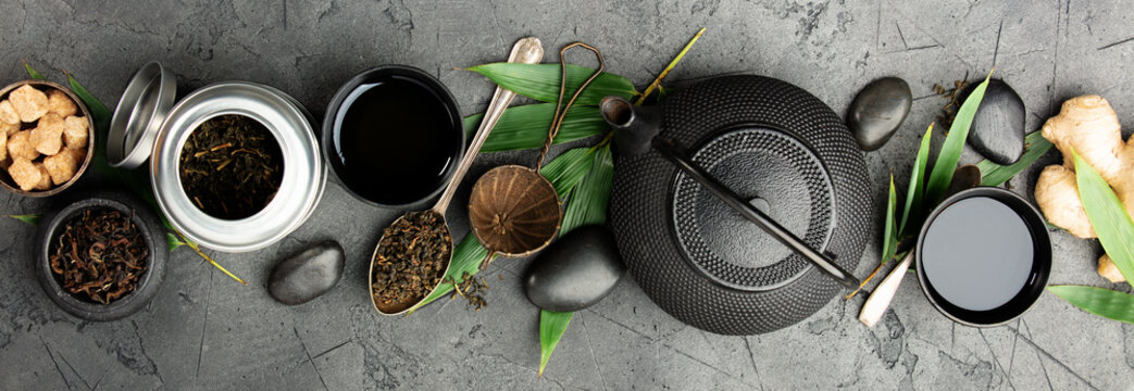 Asian Tea Ceremony Banner with Natural Ingredients on Dark Stone