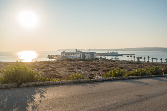 Sundown on the hill with Paradise Bay Resort and Cirkewwa passenger terminal, Mellieha MALTA