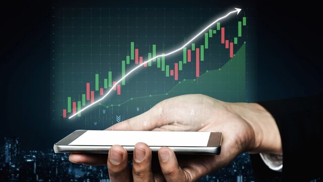 A hand holds a smartphone displaying a financial growth graph, reflecting trends in the stock market. The image symbolizes success in business and investment strategies. Copula