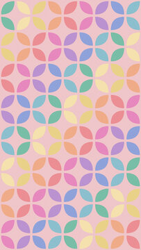 A cheerful repeating arrangement of rounded botanical shapes in soft rainbow hues over a blush ground, creating a playful modern surface for fabric, wallpaper, stationery, and packaging.