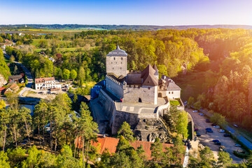 Kost Castle, located in the Bohemian Paradise region near Jičín in the Liberec area of the Czech Republic, is a medieval stone fortress surrounded by forests. © daliu