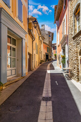 Fototapeta premium View of Goult, a small typical town in Provence, France. Discover the stunning hilltop village of Goult in Provence on a sunny day. Ancient hilltop village of Goult, Provence, France.
