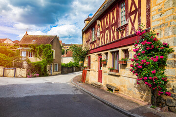 Fototapeta premium Semur-en-Auxois, Burgundy, France, medieval hilltop town with fortified walls, timber-framed houses, river valley and castle ruins