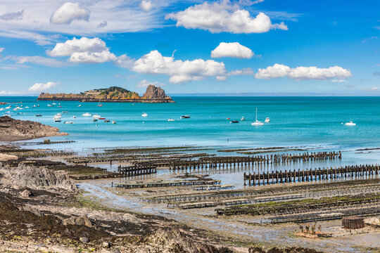 The oyster beds of Cancale in the Ille-et-Vilaine department of the Brittany region in France form a historic coastal site known for traditional oyster farming and wide tidal landscapes.