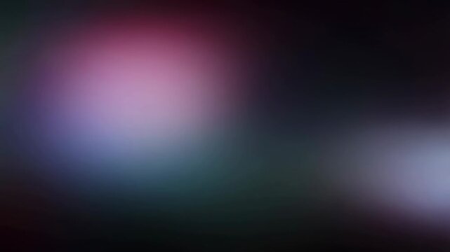Intentionally blurred soft colored light fields drift through a dark abstract background. Title sequences, technology promotion, and social media design.