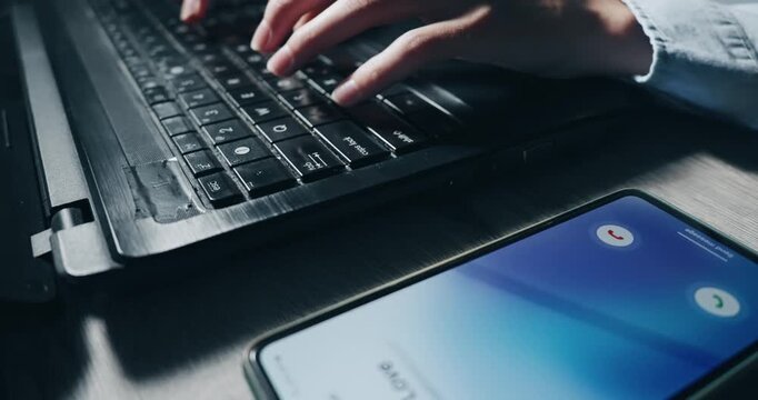 Young entrepreneur freelancer person is typing on a laptop keyboard. Concept of productivity and focus, as the person is likely working on a task or project