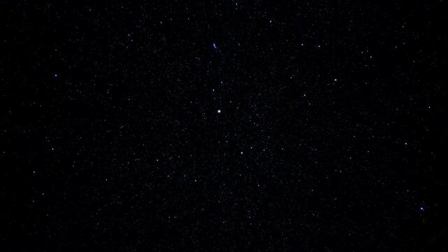 Sparse particles drift across a dark atmospheric space field. Cinematic title, science presentation, and mystery and suspense sequences.