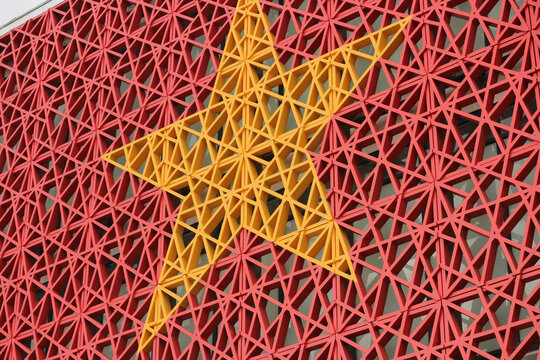 Vietnam national flag abstract geometric background, stylized yellow star on red structural wall facade pattern for Vietnamese patriotic concept