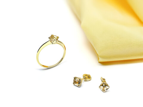 Elegant jewelry set. Jewellery set with gemstones. Product still life concept. Ring, necklace and earrings.