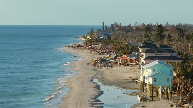 Destroyed houses on ocean shore after hurricane Milton landfall. Natural disaster consequences on Manasota Key, Florida. Storm surge severe damage.