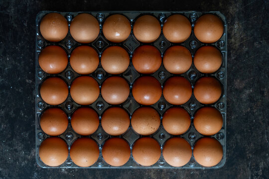 Brown eggs in a container 