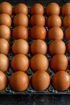 Brown eggs in a container 