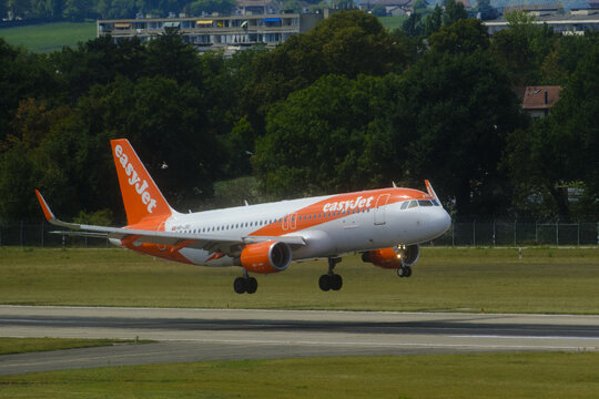 Geneva, Switzerland - August 28, 2026 : sign and logo on Airbus A320-214 of EasyJet take off from Geneva airport