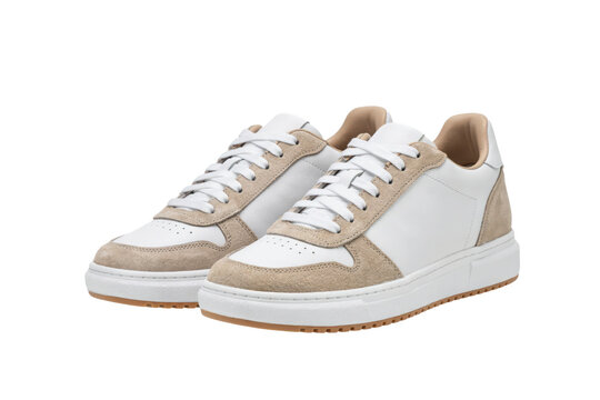 Pair of white leather sneakers with beige suede accents and white laces isolated on a transparent background
