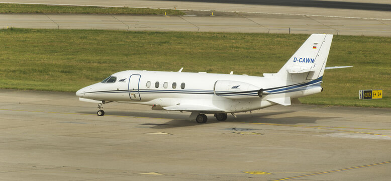 Geneva, Switzerland - August 27, 2026: Inscriptions and logo on a Cessna Citation XLS of NetJets on the runway of Geneva Airport