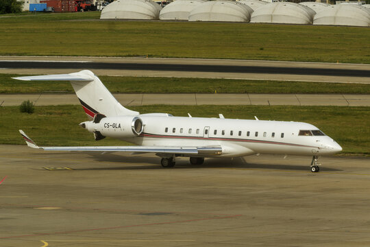 Geneva, Switzerland - August 27, 2026: Inscriptions and logo on a Bombardier Global 6000 of NetJets on the runway of Geneva Airport