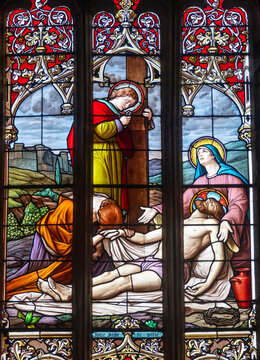 Stained glass depicting the lamentation of Christ