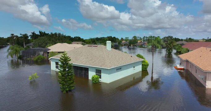 Flooded residential area with underwater houses from hurricane rainfall water in Florida suburban community. Aftermath of natural disaster in southern USA