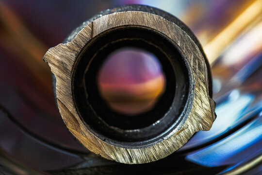 Cross Section of a Steel Coupling with Industrial Metal Background Structure and Dramatic Lighting