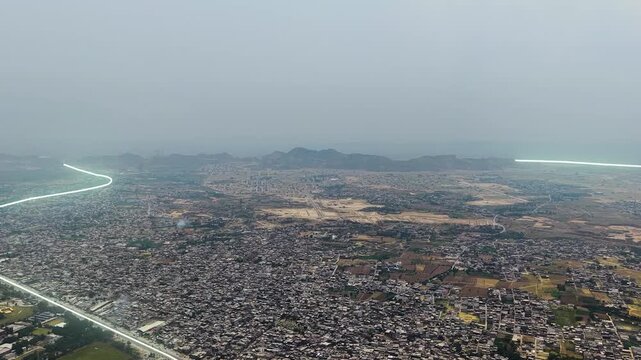 Aerial view of Faisal Hills landscape with animated light trails highlighting GT Road and M1 Motorway