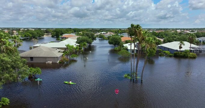 Hurricane Debby tropical rainstorm flooded cars and residential homes in suburban community in Sarasota, Florida. Aftermath of natural disaster
