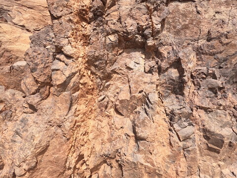 Rough, fractured mountain stone texture from civil engineering roadwork