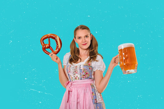 Solid German pint glass filled with fresh yellow beer, held in a woman's hand. Oktoberfest concept with copy space.