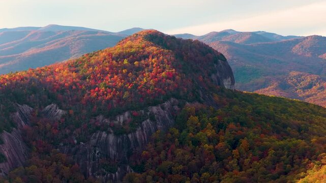 Looking Glass Rock not far from Blue Ridge Parkway near Asheville and Brevard in fall season. Pisgah National Forest with gigantic granite mountain formation.