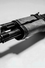 Obraz premium Close-up shot of an Ak-47 rifle in black and white. vertical frame