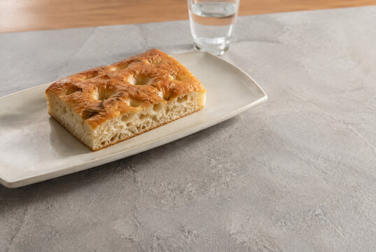 Rosemary Focaccia with Water and Modern Copy Space