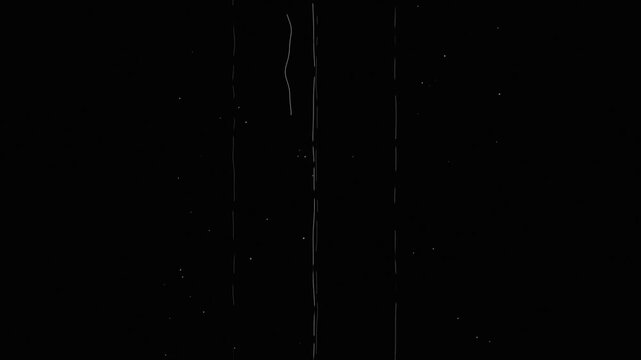 Vintage 35mm film scratch tramline dust and hair damage overlay loop on black background