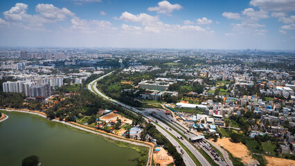 Fototapeta premium Urban lake and road network in Bangalore viewed from above