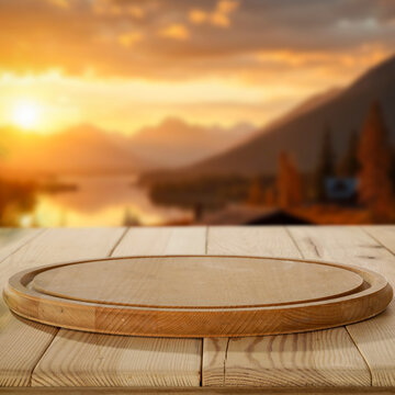 Autumn landscape with wooden table and copy space &ndash; warm seasonal concept