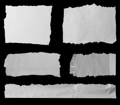 Torn papers on black
