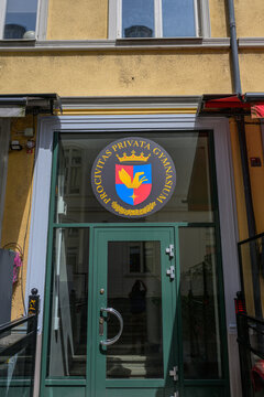 Helsingborg, Sweden - June 30 2026: Private school entrance sign on historic city building facade.