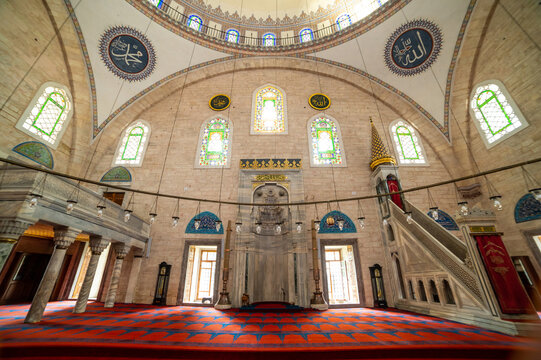 Interior of historic mosque with ornate ceiling
