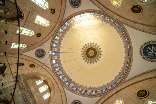 Interior of historic mosque with ornate ceiling