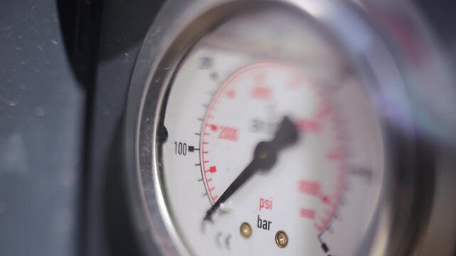 Analog pressure gauge showing pressure reading