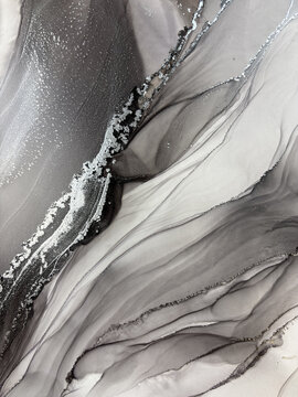 Handmade original alcohol ink abstract macro. Silver metallic fluid texture, swirling patterns, shimmer particles, glossy bubbles. Royalty free artwork, no AI.