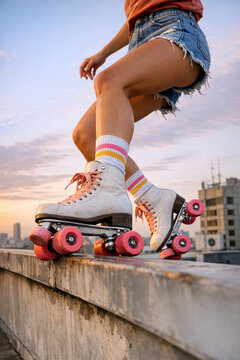 Sunset skateboarding scene with rollerblades and casual attire.