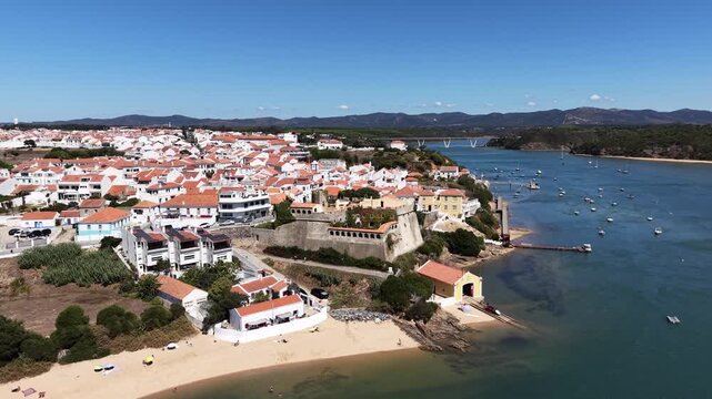Scenic aerial approaching shot of vila nova de milfontes, portugal