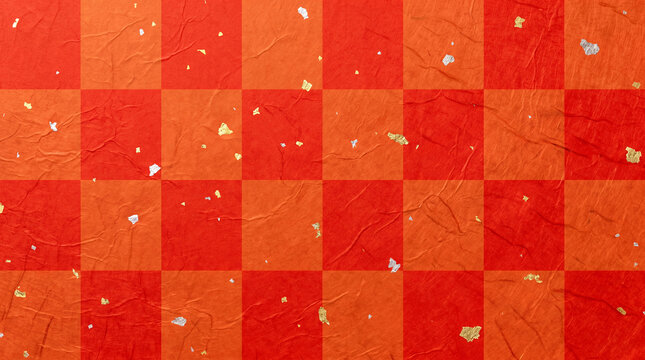 Textured red and orange checkerboard pattern paper with scattered gold and silver foil flakes, creating a festive and ornate background.