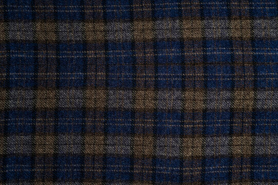 Dark blue and brown plaid wool fabric texture back